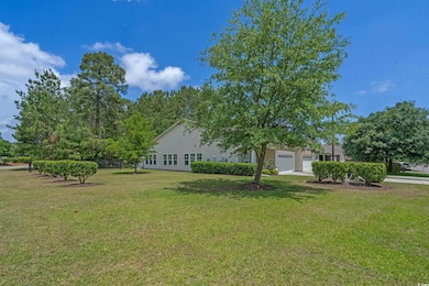 Exterior space with a garage and a front yard