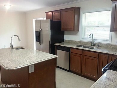 Kitchen. Additional view. Note two sinks and eat in kitchen.