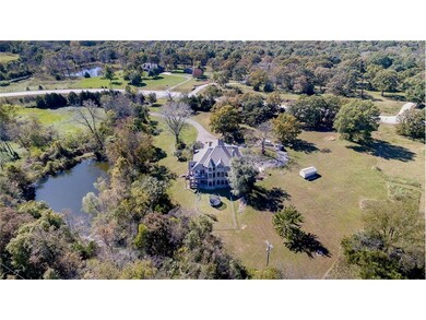 Stocked pond comes with the amazing house and view