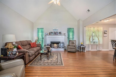 SPACIOUS LIVING ROOM WITH VAULTED CEILING AND BAMBOO HARDWOOD FLOORS.