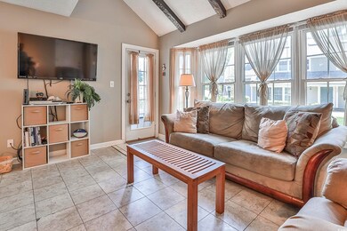 Living room featuring light tile patterned floorin