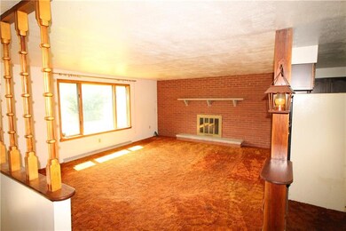 Large 19x16 Living Room w/ Brick Wall highlighting