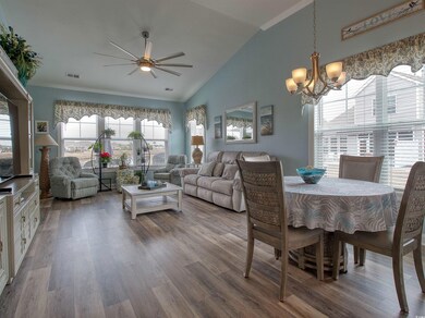 Dining area featuring high vaulted ceiling, wood-t