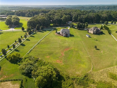 Drone / aerial view with a forest view and a rural
