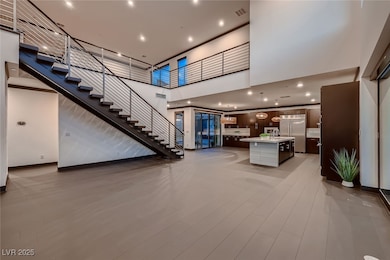 With open-concept design, gourmet kitchen, and stunning staircase.