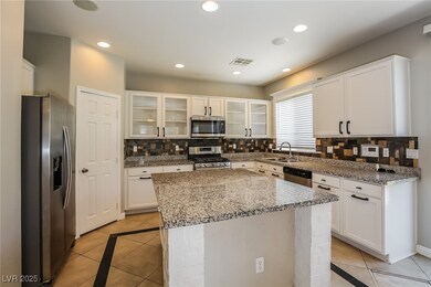 Kitchen with appliances with stainless steel finis