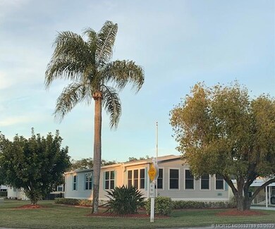 Side view on corner lot with palm trees