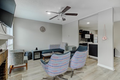 Interior space featuring a ceiling fan, baseboards