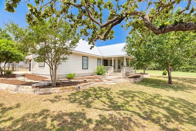 Ranch-style home featuring covered porch and a fr