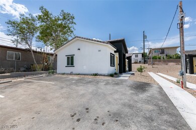 View of side of property featuring stucco siding,