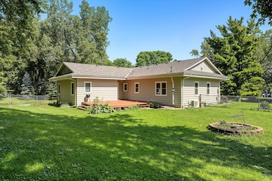 Large private backyard is fully fenced in and offers deck, gardens, fire pit and tons of space.