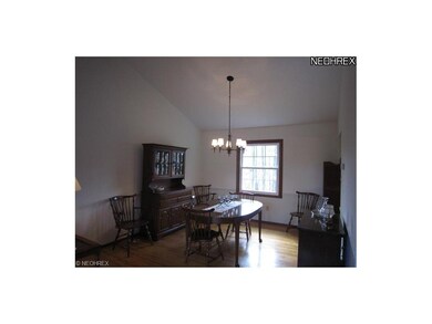 Spacious Dining Room Overlooks Wooded Yard