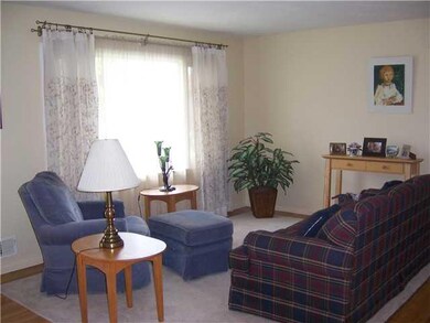 Living Room. Lovely living room with hardwood floors and pretty picture window.