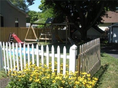 Side lot with childrens play area.
