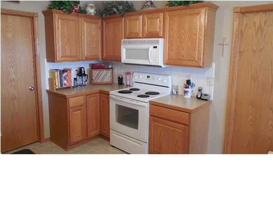 Raised panel oak cabinets with solid wood edge ban