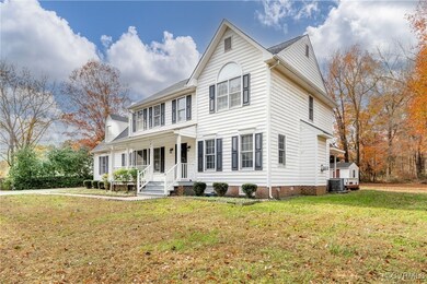 View of front of home with cooling unit, a porch,