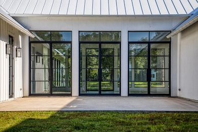 3 sets of double French doors in the back of the h