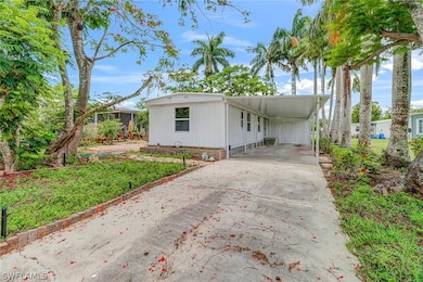 View of front of home featuring a carport