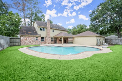 Beautiful back yard with pool/spa and covered patio.