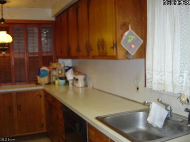 Wood cabinet and Formica counter tops.