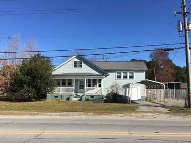 Front, holly tree on left