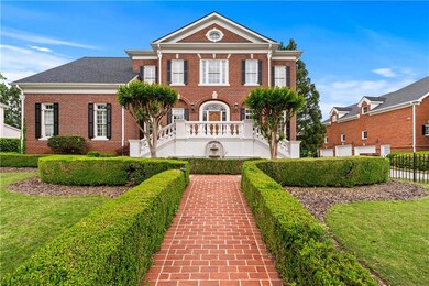 Colonial inspired home with fence, a front lawn, a