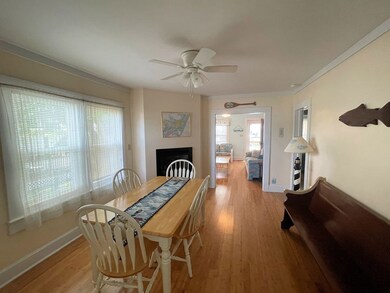 First level dining room with fireplace.