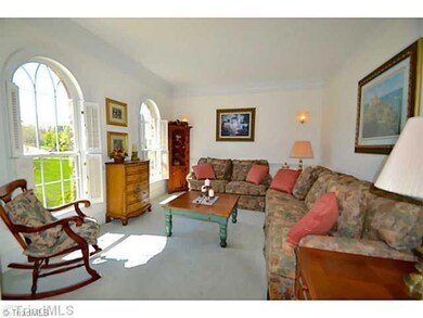 Living Room. Formal Living Room with archway and arched windows.