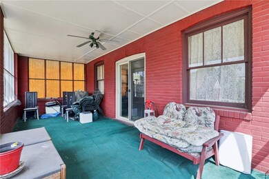 Off of the living room is a spacious screened in p