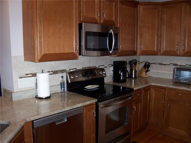 Beautiful backsplash is featured. All appliances r