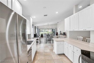 Kitchen with stainless steel appliances, light cou