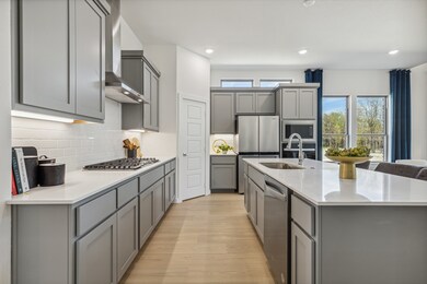 Kitchen in the Van Gogh II home plan by Trophy Signature Homes – REPRESENTATIVE PHOTO