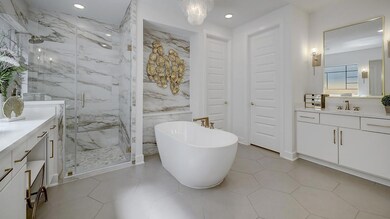 Full bathroom with vanity, a freestanding tub, a 