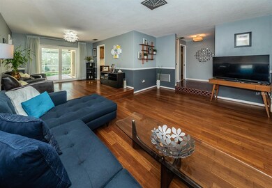 Living room with views of dining room and lanai