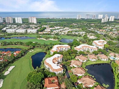 View of urban area featuring a nearby body of water, a golf club, and nearby suburban area