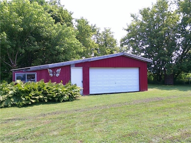 Pole barn with work shop.