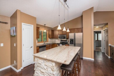 Kitchen has stainless steel appliances and granite