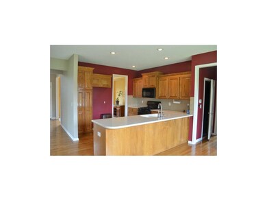 Large open kitchen with Corian countertops.