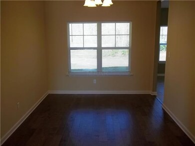 Separate formal dining room with hardwood flooring