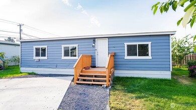 Front of home with 2 parking spots