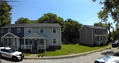 View of front of house with covered porch and a fr