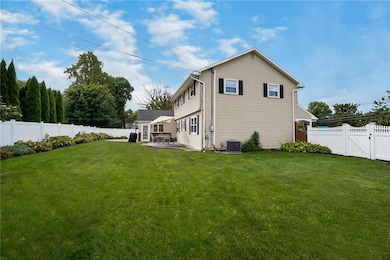 Fenced in spacious backyard with shed