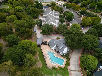 Birds eye view of property with Community Pool and