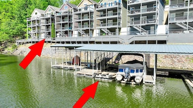 Dock area with boat lift and a water view