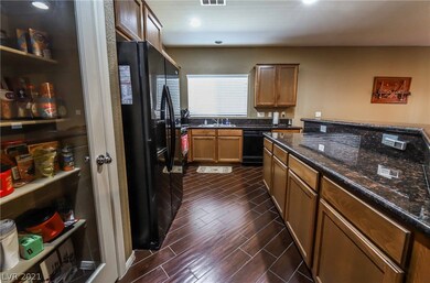 Kitchen with open floor plan and lots of cabinets.