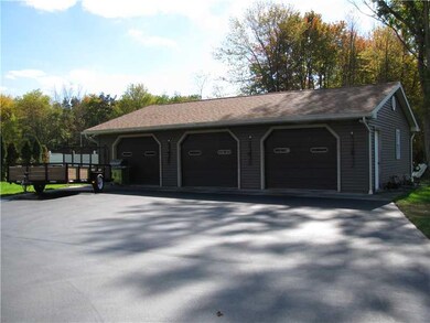 Parking Lot/Garage. BLACKTOP DRIVE. HEATED GARAGE.