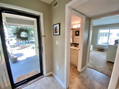 Entryway with sink and light tile patterned floors