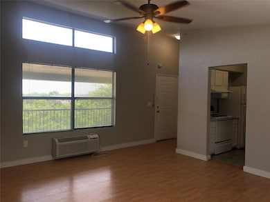 This is the living room with a high ceiling, a wal