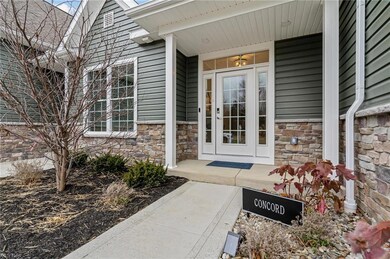 Concord entrance featuring a glass front door with side lights and a transom to let in plenty of natural light.