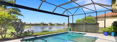View of pool with a lanai and a water view